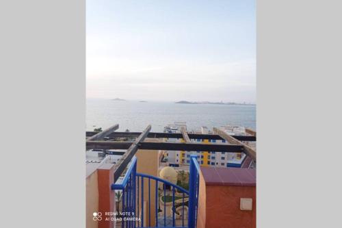 a view of the ocean from the balcony of a building at Precioso ático con solárium y vistas fantásticas in Playa Honda