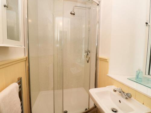 a bathroom with a shower and a sink at 2 Tayness in Kilmartin