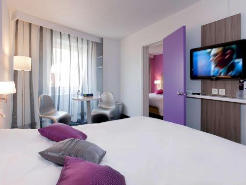 Кровать или кровати в номере ibis Styles Grenoble Centre Gare