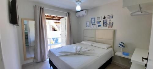 Giường trong phòng chung tại Apto 1110 - Golden Village Taperapuã