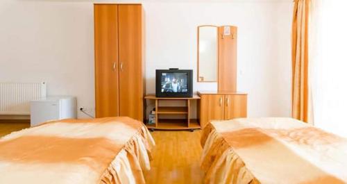 Ένα ή περισσότερα κρεβάτια σε δωμάτιο στο HOTEL ILA