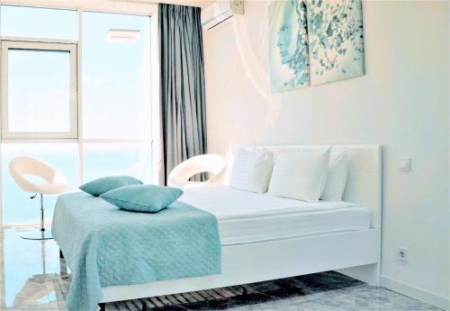 Ένα ή περισσότερα κρεβάτια σε δωμάτιο στο Sea Apartments Arcadia