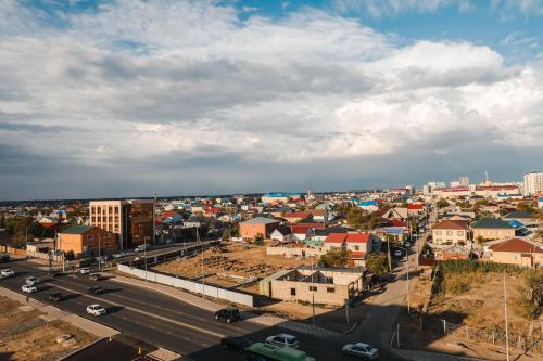 an aerial view of a city with buildings and a street at INFINITY PLAZA BLOCK 1 in Atyraū
