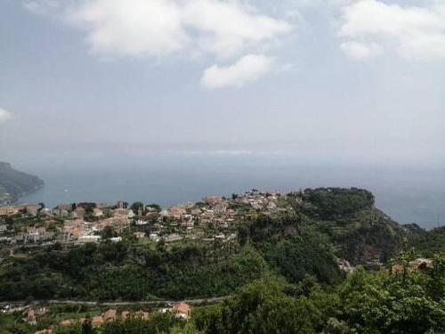 a town on top of a hill with houses at B&B Oliva in Scala