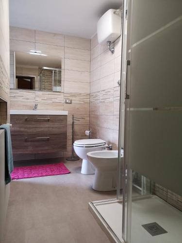 a bathroom with a toilet and a sink and a shower at Miravalle in Narni