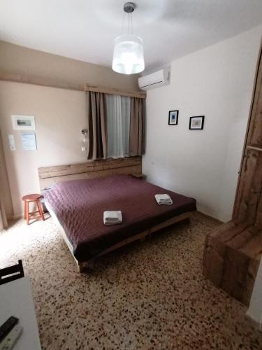 a bedroom with a large bed in a room at Villa Teo in Kalamata