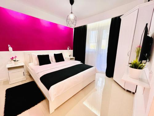 Llit o llits en una habitació de Vero Holiday Apartment