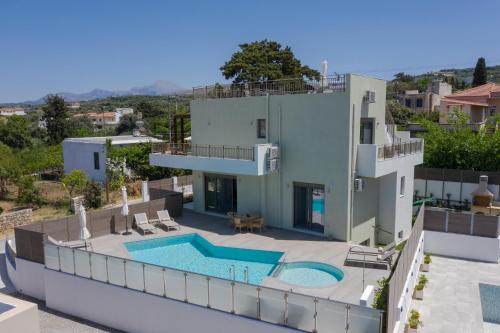 an aerial view of a house with a swimming pool at Manuel's Dream in Ádhele