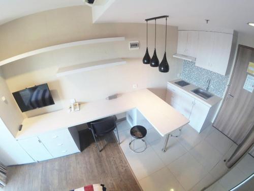 an overhead view of a kitchen with a white counter top at Student Park 636 by We Stay in Yogyakarta
