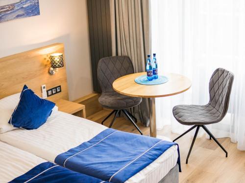 Posteľ alebo postele v izbe v ubytovaní Cobalt Apartments