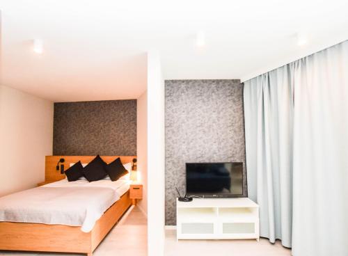 Ένα ή περισσότερα κρεβάτια σε δωμάτιο στο Apartamenty nad Wisłą