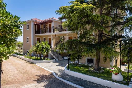 an exterior view of a house with trees at BUENA VISTA studios in Lourdhata