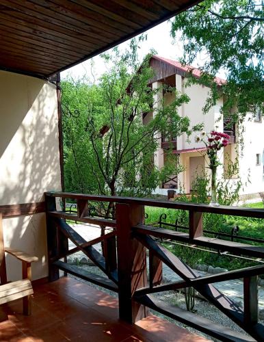 a balcony with a view of a building at Котедж-парк Славна in Okhtyrka