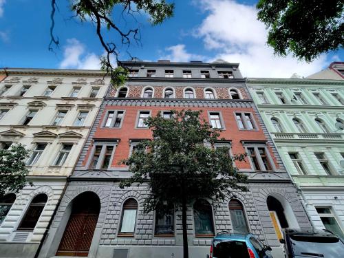 a large brick building on a city street at Eight Secrets Boutique Residence in Prague