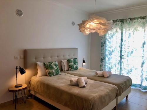 Cama o camas de una habitación en Âncora Boutique Apartments