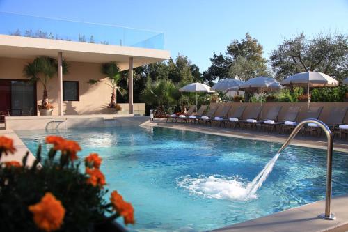 a swimming pool with a person in the water at Seventeen Hotel in Valbonne