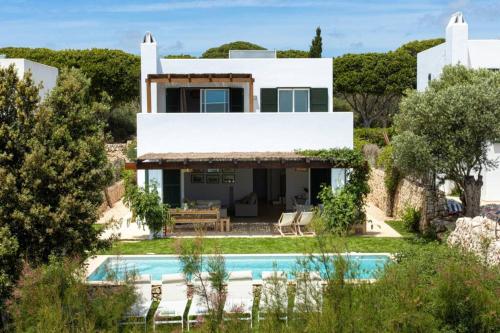 an image of a villa with a swimming pool at Villa Conguitos in Sant Lluis