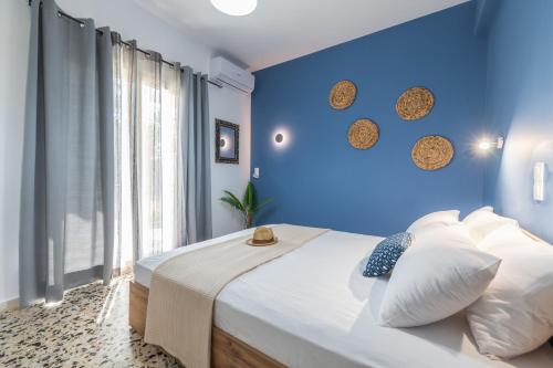 מיטה או מיטות בחדר ב-Lazaris Apartments