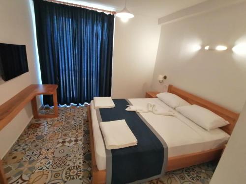 Cama o camas de una habitación en Akcapinar Korfez Butik Otel