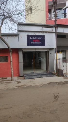 a building with a sign that reads associate hotel at hotel sonali regency in Bhopal