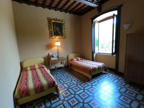 Katil atau katil-katil dalam bilik di Agriturismo Montecorona