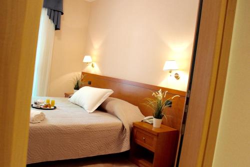 Säng eller sängar i ett rum på Hotel Jole