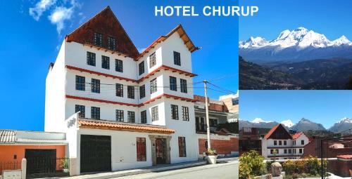 a large white building with mountains in the background at Hotel Churup in Huaraz