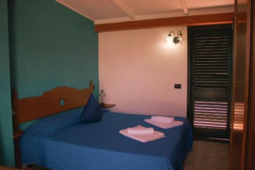 Ένα ή περισσότερα κρεβάτια σε δωμάτιο στο La Trinacria