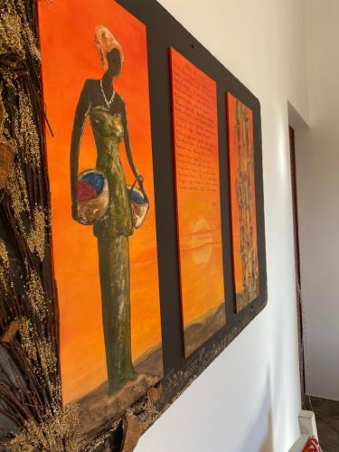 a painting of a woman hanging on a wall at Baglio Mazzara in Custonaci