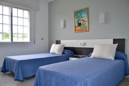 Cama o camas de una habitación en Dukes Habitaciones