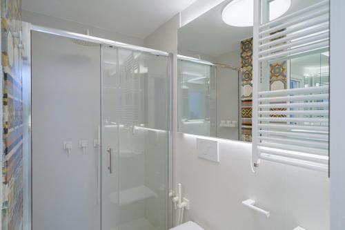 a bathroom with a shower and a glass shower stall at Sopramonte Exclusive Rooms in Capri