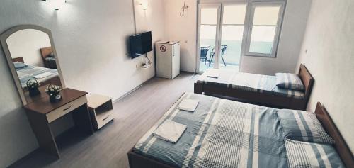 TV a/nebo společenská místnost v ubytování Apartmani Kaldrma