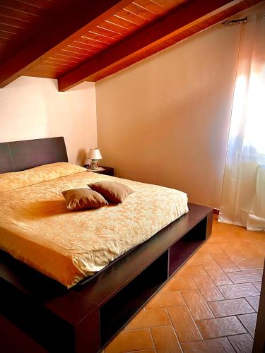 a bedroom with a bed in a room with a window at Agriturismo le tre stelle in Paestum