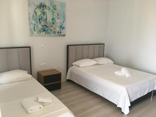 Postel nebo postele na pokoji v ubytování IRINI boutique rooms!!!