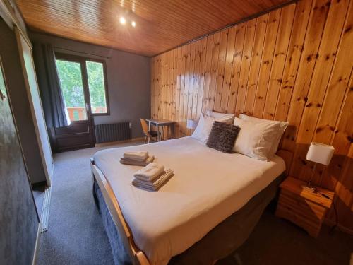 Postel nebo postele na pokoji v ubytování Hotel Le Beau Site