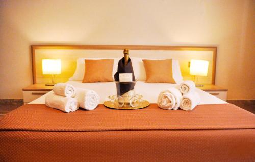 a hotel room with a bed with towels on it at *1*7*4* Via Roma in Palermo