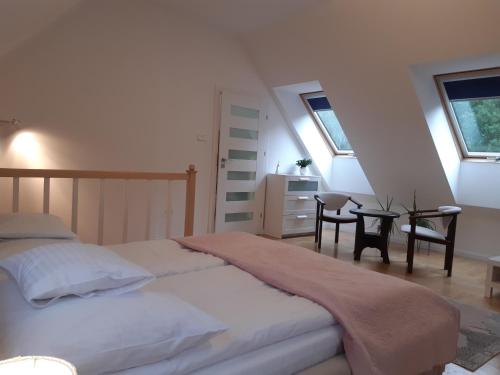 Posteľ alebo postele v izbe v ubytovaní Apartamenty przy Stoku Mrągowo