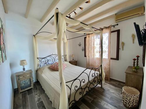 Postel nebo postele na pokoji v ubytování Petridi Maria Suites & Apartments