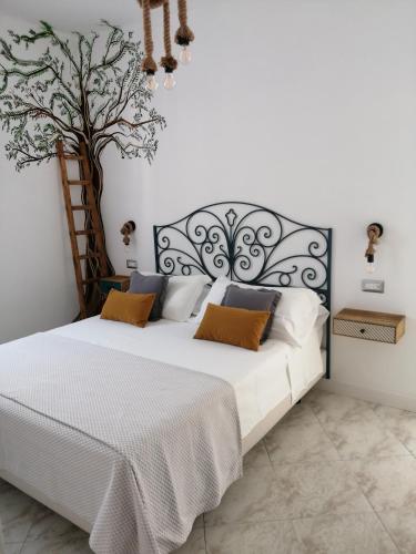 Ένα ή περισσότερα κρεβάτια σε δωμάτιο στο B&B Mario Relais