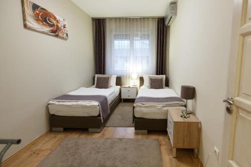 Postel nebo postele na pokoji v ubytování Mokka Apartments