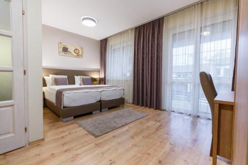 Postel nebo postele na pokoji v ubytování Mokka Apartments
