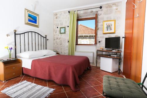 Un pat sau paturi într-o cameră la Villa Filipa