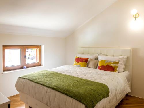 A bed or beds in a room at Cicciobello Lux Apartment Baošići with stunning sea view