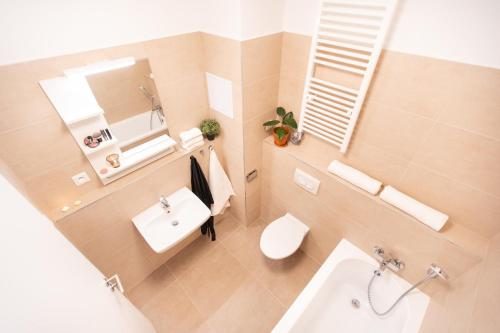 an overhead view of a bathroom with a toilet and a sink at Apartmán Vila Zuberec in Zuberec