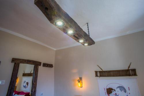 a ceiling light hanging from the ceiling of a room at Djurdjevina Family Farm in Kolašin