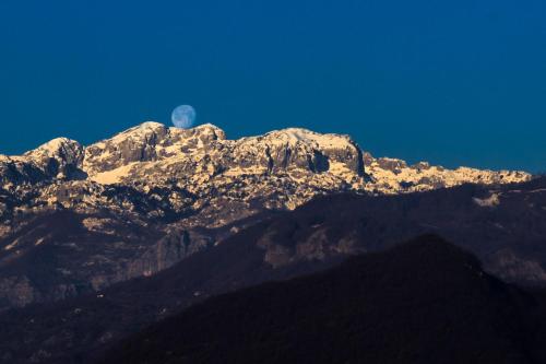 a mountain with the moon in the background at Djurdjevina Family Farm in Kolašin