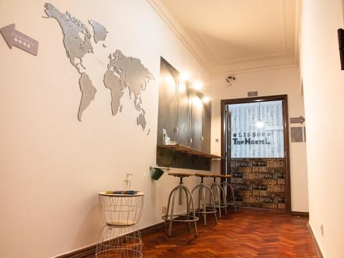 a room with a map of the world on the wall at Lisbon Top Hostel in Lisbon