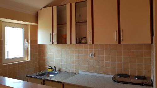 Кухня или мини-кухня в Apartments Belmare
