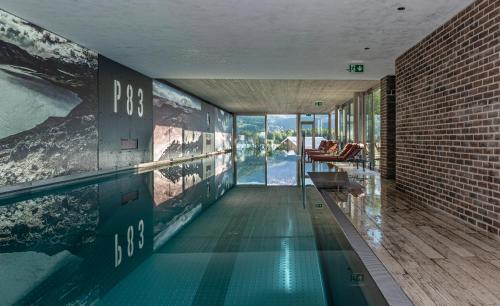 a swimming pool in the middle of a building at Cortisen am See - Adults only in St. Wolfgang