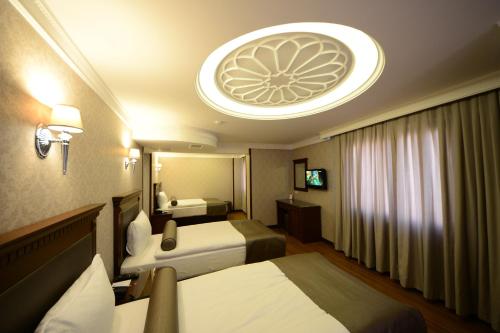 Gulta vai gultas numurā naktsmītnē Grand Bazaar Hotel